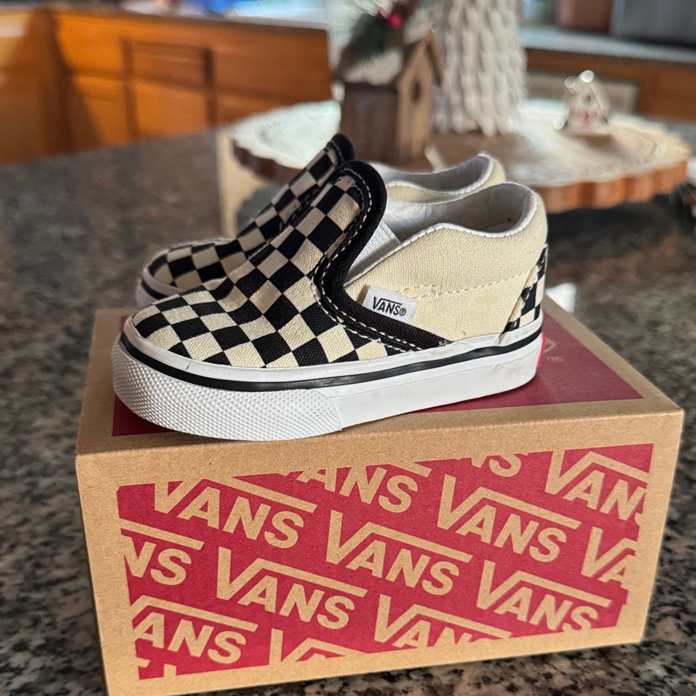 Vans Black and White Checkerboard Slip-On Sneakers